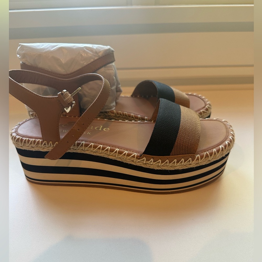 Brand new Kate Spade wedge-size 39.  NEVER WORN.  Comes in original box.